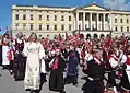 The children's parade passes the Royal Palace during the Norwegian Constitution Day