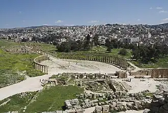 The Greco-Roman city of Gerasa and the modern Jerash in the background.