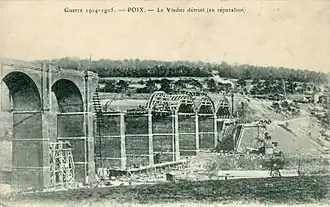 The railway viaduct, under repair after destruction during World War I
