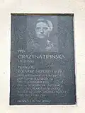 A commemorative plaque at 8 Alliance Square, dedicated to Grażyna Lipińska.