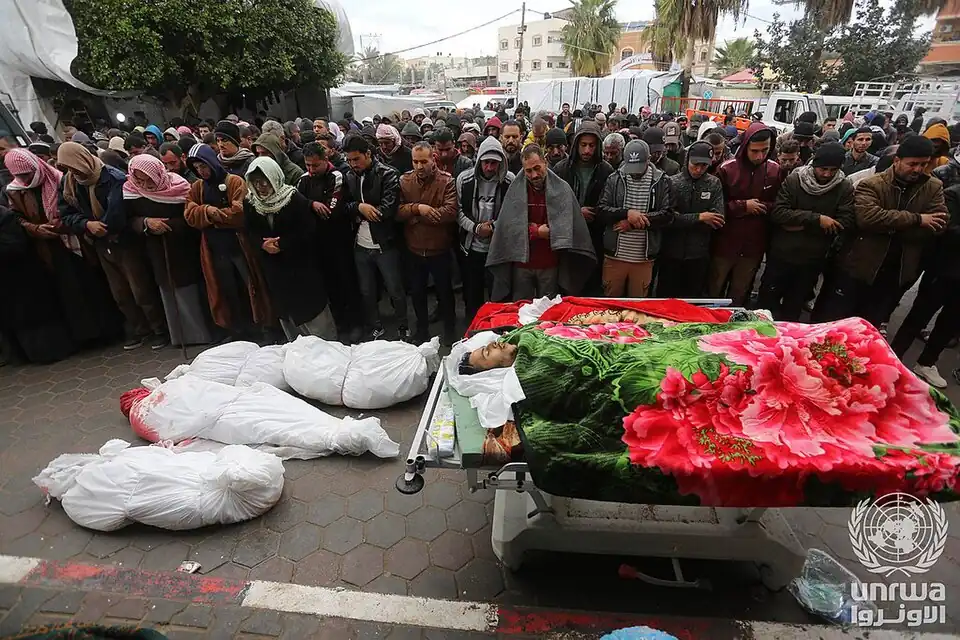 Palestinians bid farewell to their relatives who were killed in an Israeli airstrike of Deir el-Balah, 2024.