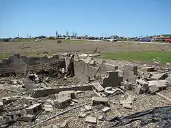 The foundation of a house completely swept away by a tornado in Parkersburg, Iowa