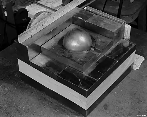 The sphere of plutonium surrounded by neutron-reflecting tungsten carbide blocks in a re-enactment of Daghlian's 1945 experiment[6]