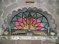 The early 16th century tomb alcove of Richard Littleton and Alice Wynnesbury in the south nave aisle, now used for votive candles. Originally this part of the church was a Littleton family chapel.