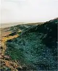 A view of the outer defence wall at Penycloddiau hill fort