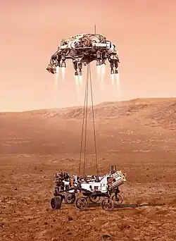 An illustration of Perseverance tethered to the sky crane