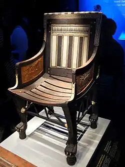 Ancient Egyptian armchair of Tutankhamun; 1336–1326 BC; wood, ebony, ivory and gold leaf; height: 71&nbsp;cm; Exposition of Tutankhamun Treasure in Paris (2019)
