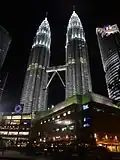 Night image of the Petronas Towers in Kuala Lumpur, taken from behind