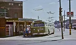 An older trackless trolley loading on route 66 in 1978