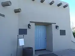 The Webster Auditorium building was constructed in 1939 and is located inside the compounds of the Desert Botanical Garden. In 1937, Gertrude Webster joined newly established Arizona Cactus and Native Flora Society. The auditorium is named after her. In 1990, the National Park Service certified Webster Auditorium as a national historic site and assigned it the reference number 9000823.