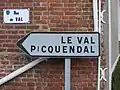 A street sign in Merck-Saint-Liévin, showing Germanic influence in local toponyms. The name Picquendal corresponds to the modern Dutch Piekendal.