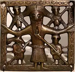 Crucifixion plaque found in Killaloe, County Clare, 11th century, NMI. H: 7.3&nbsp;cm (2.9&nbsp;in)[40]