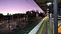 Westbound view from Platform 1, January 2021. The junction of Punt Road and Olympic Boulevard is to the left, with AAMI Park in the distance