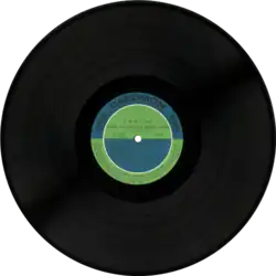 12-inch vinyl record disc with green-and-blue inner label