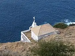 The old white column, later replaced by the new black and white tower