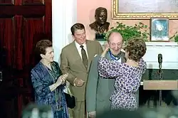 Horowitz, accompanied by his wife Wanda Toscanini, receives the Presidential Medal of Freedom from President Ronald Reagan and First Lady Nancy Reagan (presenting it to him)