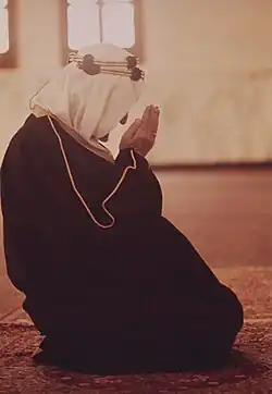 Faisal praying in a mosque