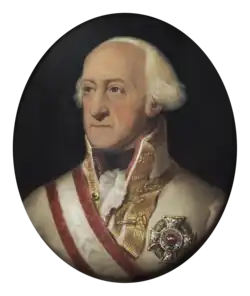 Painting of a white-haired man with a receding hairline. He wears a white military uniform with gold braid on the collar while his chest is adorned with a large silver award and a red and white sash.