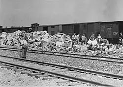 Photograph of prisoners sorting confiscated property at Auschwitz II-Birkenau