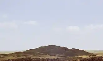 A photograph of the mound of sand that comprises the destroyed remains of the pyramid, called 'Merenre's beauty shines', which belonged to Merenre Nemtyemsaf&nbsp;I.