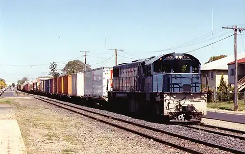 Queensland Rail 2174D traversing Denison St, Rockhampton, c. 2000 (Now TFR no. D35-802)