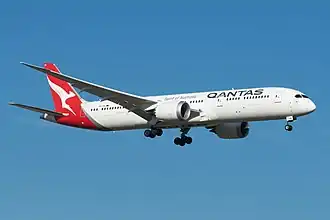 A Boeing 787-9 Dreamliner with Qantas livery in flight