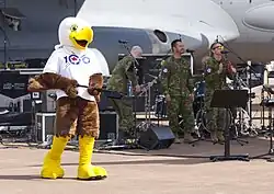 This band. Men in army fatigues and an eagle mascot.