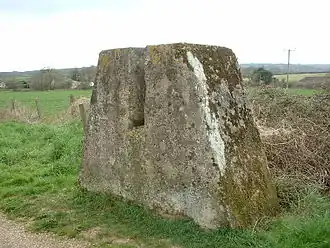 One of a pair of blocks that allowed the railway line to be blocked quickly by inserting a barrier such as a section of rail. The rail block was intended to stop enemy tracked vehicles from travelling along the railway route. The mass of concrete stands on a foundation and is about 5 feet (1.5&nbsp;m) high.