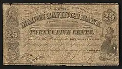 25-cent bill inscribed "THIS CERTIFIES THAT THERE HAS BEEN DEPOSITED IN THE MACON SAVINGS BANK IN CONFEDERATE TREASURY NOTES TWENTY FIVE CENTS. Payable to the Holder with FOUR PER CENT INTEREST. after thirty days notice in Confederate Treasury Notes when presented in sums of FIVE DOLLARS MACON, GA. March 16. 1863."