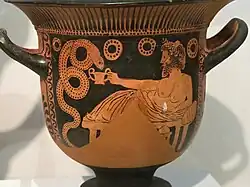 Vase painting of Cabeiros, reclining, near a snake