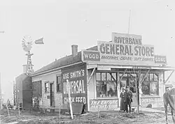 Black-and-white photograph of the Riverbank general store, with "Yolo County Free Library" among other signage.