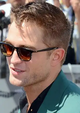 Pattinson talking while wearing sunglasses