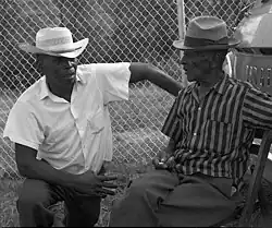 Blues singers Robert Pete Williams talking to Mance Lipscomb