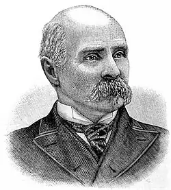 An engraved portrait of an elderly man with a mustache and wearing a suit and tie