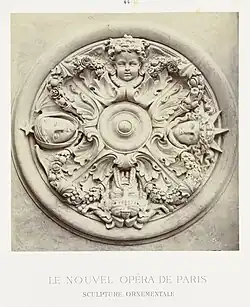 Neoclassical mascarons in a round ceiling ornament that depicts the four cardinal points, designed by Charles Garnier, c.1860–1875