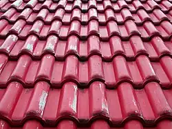 Interlocking tile designed to look like pantile