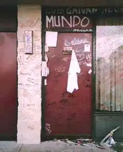 Graffiti left by fans at the motel room door leading to Room 158 where Selena met with Saldívar before being shot by her. Outside the room is some trash on the ground