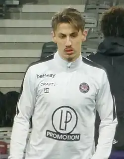 Bust of Anthony Rouault, dressed in Toulouse White training shirt