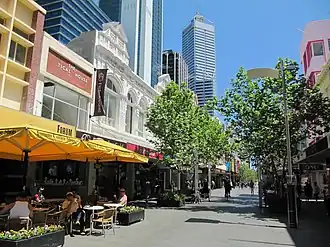Shops and trees lining a car-less street