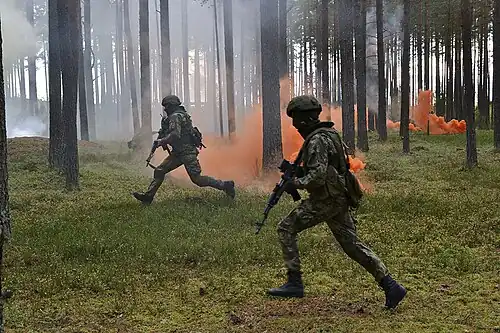 Russian soldier using an AK rifle with 1P63 sight during an exercise