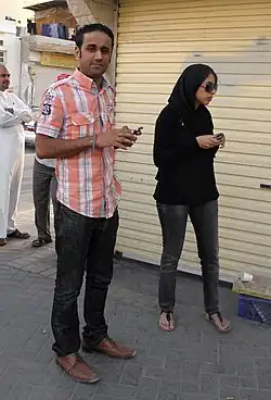 S. Yousif al-Mahafdha and Zainab al-Khawaja obsvering a protest in Jidhafs