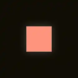 A peach-colored square on a black background, with a faint glow emanating from it