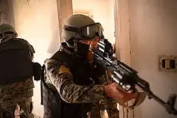 SDF Commandos receiving CQB (close quarters combat) training from U.S. Army personnel