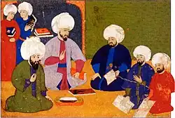 The consultation for the programme of the Şahname-ı Selim Han, with the scholars Şemseddin Ahmet Karabaği, Seyyid Lokman, the writer Ilyas Katib and the painters Nakkaş Osman and Ali, 1571–81 (folio&nbsp;9r)