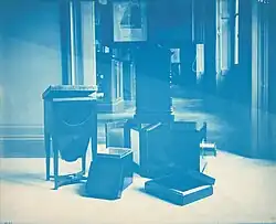 cyanotype image of daguerreotype tools, mainly large boxes
