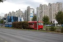 Tram in front of the neighbourhood's residential buildings