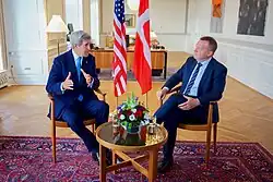 John Kerry and Lars Løkke Rasmussen sitting in the chairs at the Danish Prime Minister's Office in Copenhagen