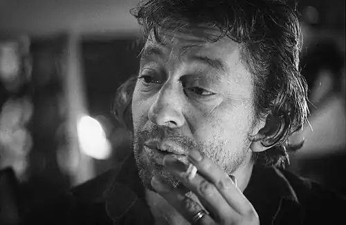Image 12 Serge Gainsbourg Photograph credit: Claude Truong-Ngoc Serge Gainsbourg (1928–1991) was a French musician, singer-songwriter, actor, author and filmmaker. Regarded as one of the most important figures in French pop music, he was renowned for often provocative and scandalous releases which caused uproar in France, dividing its public opinion, as well as his diverse artistic output, which ranged from his early work in jazz, chanson, and yé-yé to later efforts in rock, zouk, funk, reggae, and electronica. He is often regarded as one of the world's most influential popular musicians. His lyrical works incorporated wordplay, with humorous, bizarre, provocative, sexual, satirical or subversive overtones. Gainsbourg's music has reached legendary stature in France, and he has become one of the country's best-loved public figures. He has also gained a cult following all over the world with chart success in the United Kingdom and Belgium with "Je t'aime... moi non plus" and "Bonnie and Clyde", respectively. This photo of Gainsbourg was taken in 1981. More selected pictures