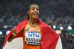 Hassan celebrating with a Dutch flag around her