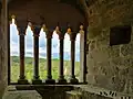 View of Laussel castle through a window in the keep.